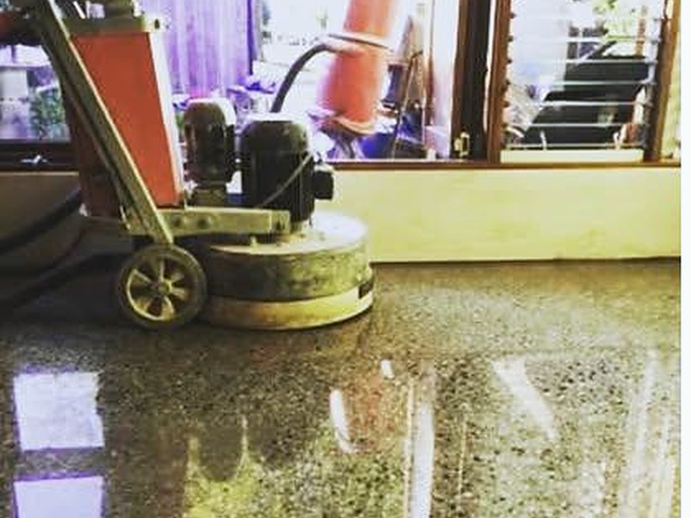 Concrete floor being mechanically ground and prepared by CHA in Melbourne