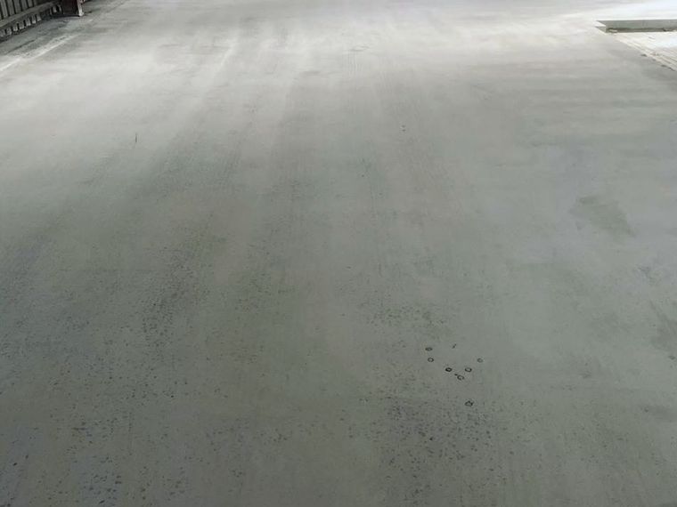 Concrete floor being ground with a grinding machine