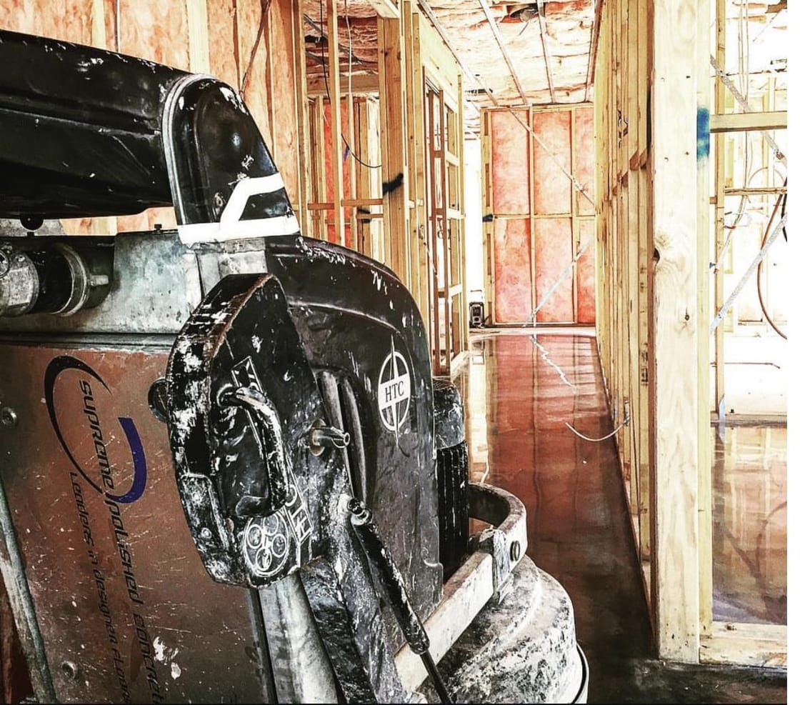 Industrial floor grinding machine removing coatings during concrete surface preparation
