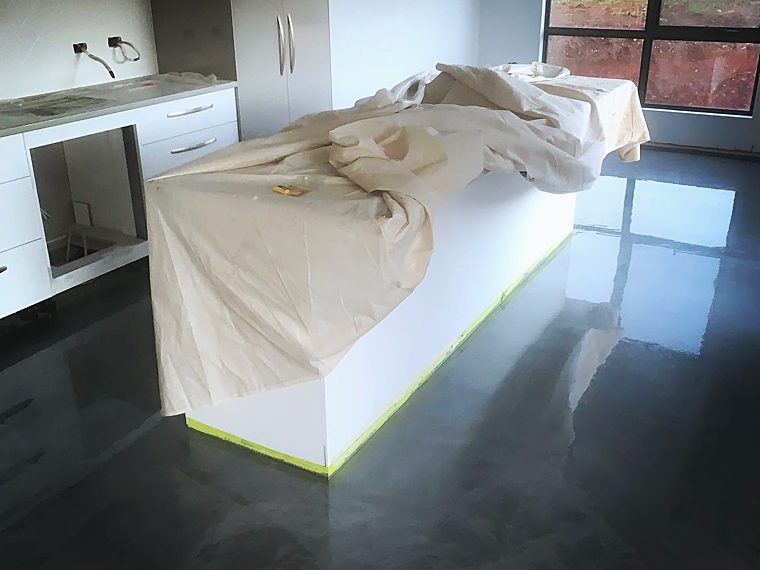 Epoxy floor coating being applied