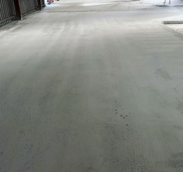 Representative ground concrete floor in a warehouse