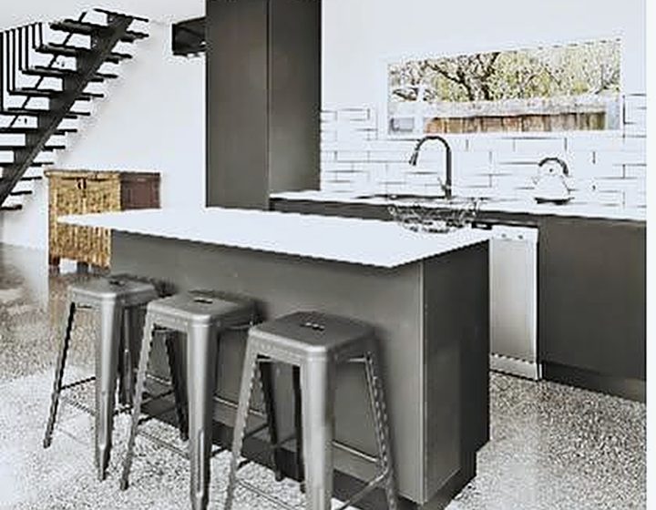 Polished concrete floor in a modern kitchen with island bench